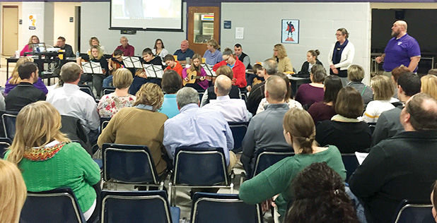 Litchfield Middle School students in a newly formed guitar class, under the direction of music teachers Ellis Henley and Cassie Lord-Remmert-McKorkle, performed two songs to a packed house at the Litchfield School Board meeting on Thursday evening, Feb. 15.