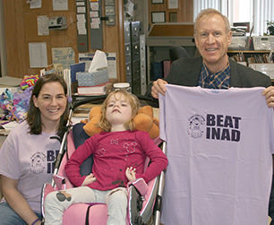 The Herschelmans presented the governor with a Beat INAD T-shirt. From the left are Mary and Grace Herschelman and Gov. Bruce Rauner.