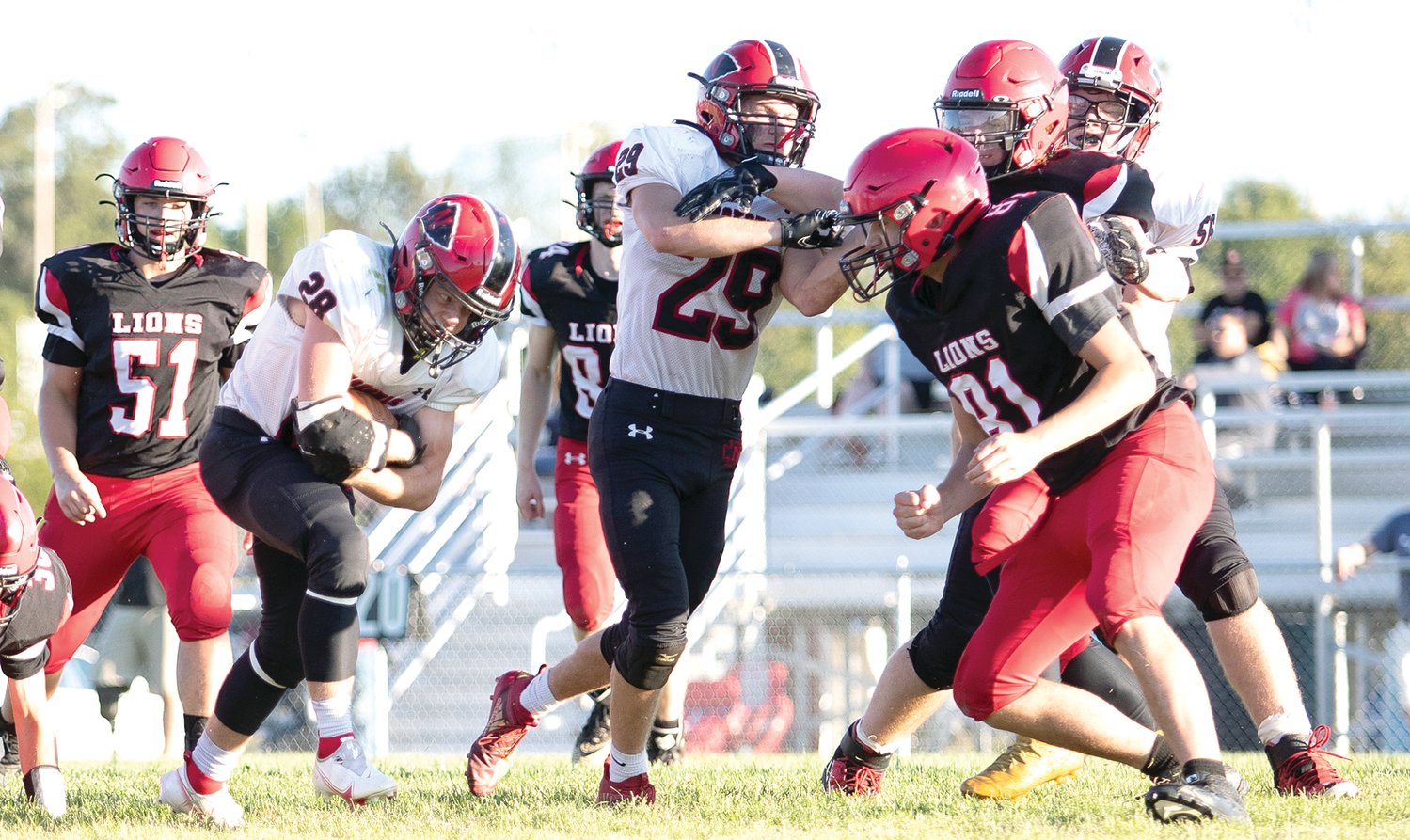 Nokomis' Matthew Hill (#29) and Mason Morris (#56) clear a path for Jake Watson (#28) during the Redskins' game against Edwards County on Saturday, Sept. 25, in Albion. Watson, who ran for 160 yards, and Hill, who ran for 180 yards, helped the Redskins pick up nearly 500 yards on the ground in a 59-3 victory over the Lions.