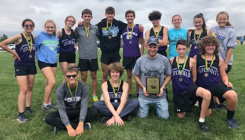 Eleven of the 14 Litchfield runners medaled at the Southwestern Invitational on Saturday, Oct. 2, as the boys placed first and the girls took third. In front, from the left are Alex DeLaCruz, Kevin Pollard, Coach Jeremy Palmer, Kenny Traylor and Peyton Baugher. In the back are Myka Fenton, Kylee Eiting, Delanie Ulrich, Gavin Thimsen, Camden Quarton, Sam Horn, Brayden Davis, Emma Hughes, Harlee Traylor and Joelle Hughes.